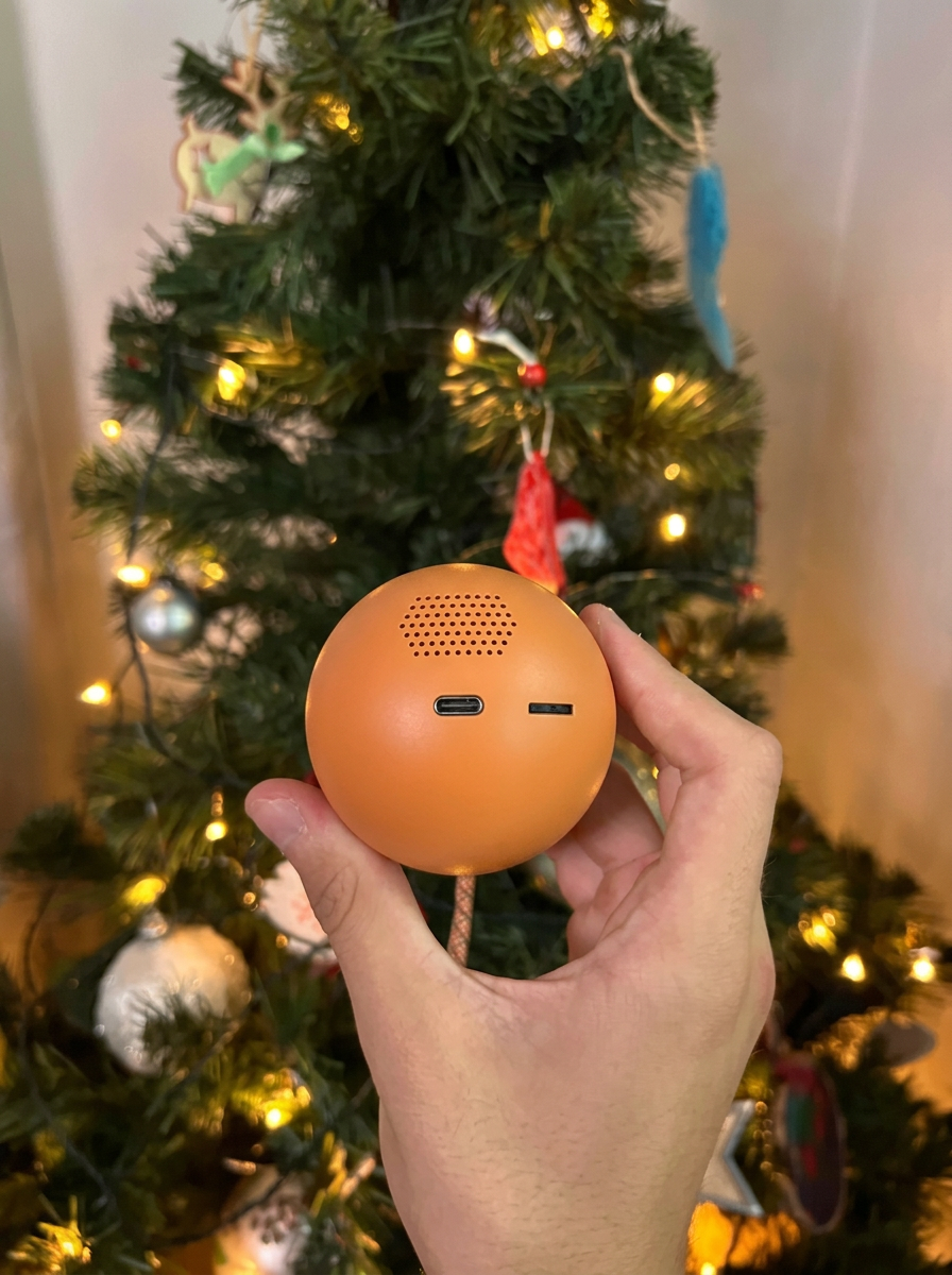 Back of the orange Noel Orb with the USB-C port